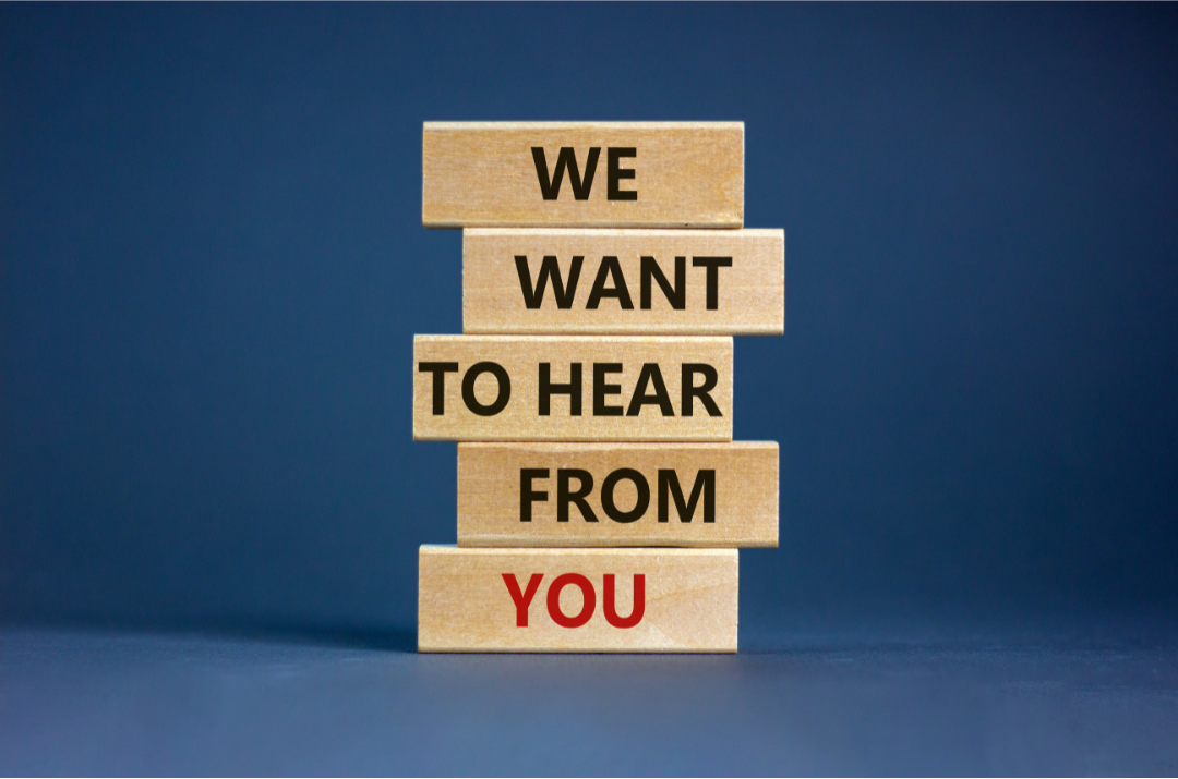 tower of blocks that spell out we want to hear from you